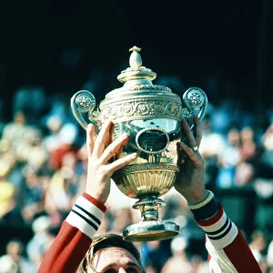 Wimbledon 1977. Bjorn Borg holds up the trophy after winning the men