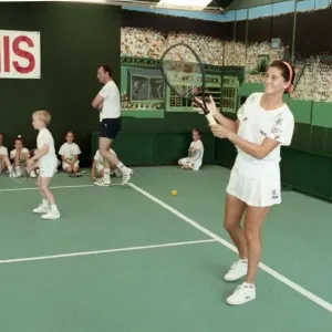 Wimbledon Print: Monica Seles with Children at Short Tennis