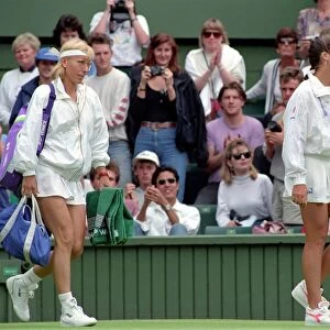 Wimbledon Tennis. J. Capriati and Navratilova walk onto the court. July 1991 91-4197-103