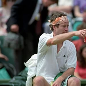 Wimbledon Tennis. John McEnroe (With Eric Crapton Watching). July 1991 91-4197-001