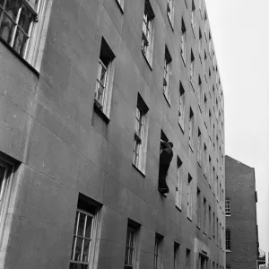 Window cleaning in Park Lane, London. 10th April 1954