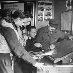 A wing commander briefs his pilots in the new speedier ways which are needed to fight in A wing commander briefs his pilots in the new speedier ways which are needed to fight in