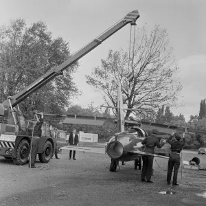 The wings being attached to a Folland Gnat of the Red Arrows in preparation for a Royal The wings being attached to a Folland Gnat of the Red Arrows in preparation for a Royal