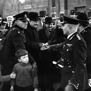 Winston Churchill British Prime Minister shaking hands with people on the street during