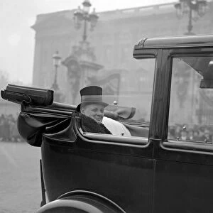 Winston Churchill is seen driving to Buckingham Palace to recieve the seal of