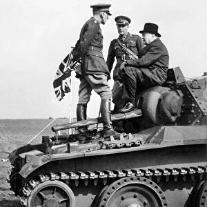 Winston Churchill sitting on a Tank in France, 1944