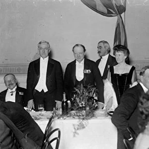 Winston Churchill stands alongside United States Ambassador to the United Kingdom John W