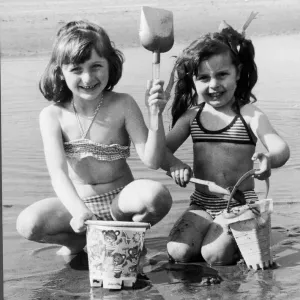 Wish you were here! Sharon-Anne Taney, left, and Maria Grant build a sand castle in Wish you were here! Sharon-Anne Taney, left, and Maria Grant build a sand castle in