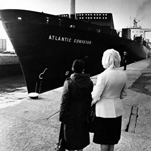 Two wives watch as the The Atlantic Conveyor, a British merchant navy ship