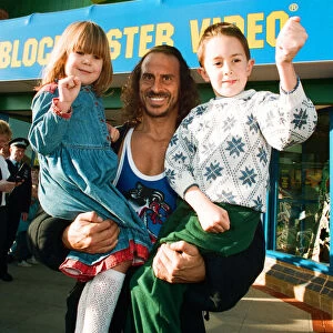 Wolf from Gladiators opening the new Blockbuster Video in Reading. 6th November 1994