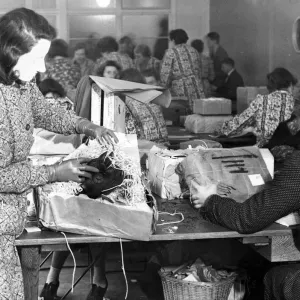 A woman checks for contraband in a sorting office in Aintree, Liverpool. November 1939 A woman checks for contraband in a sorting office in Aintree, Liverpool. November 1939