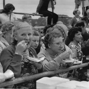 Woman enjoying a portion of the world famous Denby Dale Pie