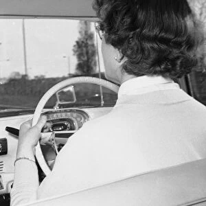 Woman learner driver seen here behind the wheel of a Vauxhall Victor