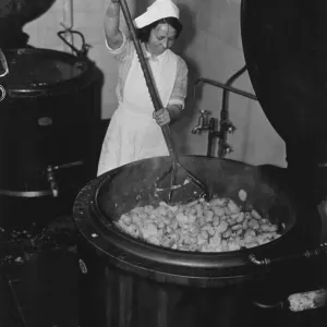 A woman mashing potatoes to feed the poor in Liverpool, Labour A woman mashing potatoes to feed the poor in Liverpool, Labour