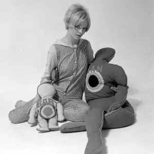 Woman Model with pillows in the shape of man and child. January 1968