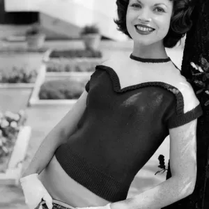 1956 Vintage Print - Woman Modelling Knitwear