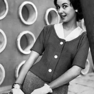 A woman modelling Knitwear. September 1956