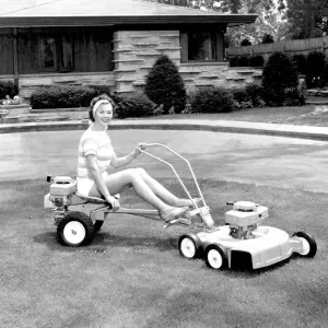 Print of a woman mowing the lawn with a sit-down lawnmower