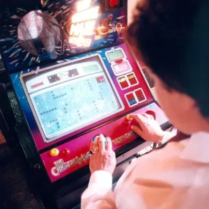 A woman playing on a one armed bandit or electronic gaming machine in November 1999 A woman playing on a one armed bandit or electronic gaming machine in November 1999