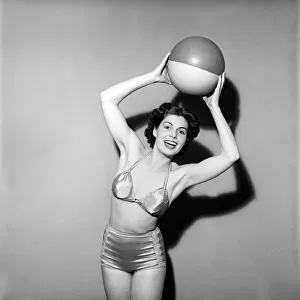 Woman in Swimming costume holding beach ball. 1960 E67-002