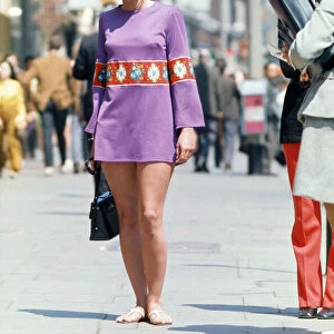 Woman walking down Kings Road, Chelsea, London. June 1970