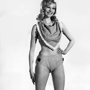 Woman wearing a bikini with unusual neckscarf. June 1962 P011069