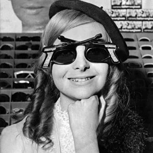 Woman wearing "Bonnie and Clyde"sunglasses. February 1968