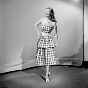 Woman wearing checked dress October 1952 C5178-001