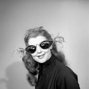 Woman wearing face masks. February 1953