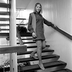 Woman wearing a mini skirt standing on the steps Linda Sewell December 1969