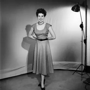 Woman wearing a pinafore dress November 1952 C6272-002 Woman wearing a pinafore dress November 1952 C6272-002