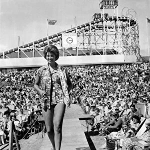Women: Beauty contests mirror beach fashion show. June Marshall models a French cotton