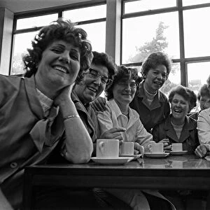 Nine women at Berkey Technical Limited, Thetford, celebrate the news that they will be