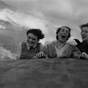 Three women were bounced and soaked as each big wave drenched them whilst on a high speed Three women were bounced and soaked as each big wave drenched them whilst on a high speed
