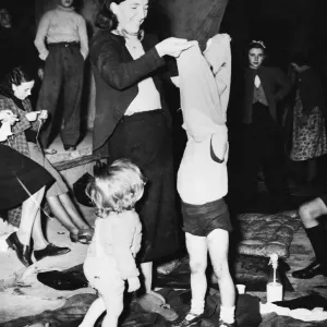 Women and children prepare to sleep in a bomb shelter during Second World War Women and children prepare to sleep in a bomb shelter during Second World War