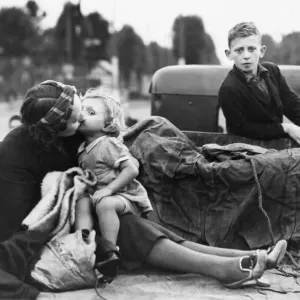 Women and children preparing to evacuate their town before nightfall during Second World Women and children preparing to evacuate their town before nightfall during Second World