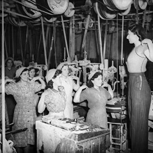 Women doing Physical excercises in a Factory before starting work in a factory 1941 women