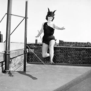 Women dressed as She Devil. Model: Pamela Dennis. May 1957 E270-006