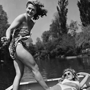 Two women enjoying the sun whilst cruising up the River Thames July 1948