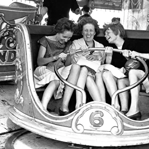 Women enjoying themselves on the Waltzers fair ride. Hearsall Common, Coventry
