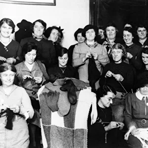 Women kitting comforts for the forces of the British Legion