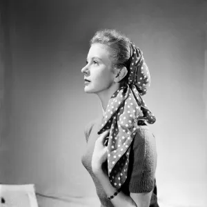 Women modelling an adaptable scarf. June 1952 C3240