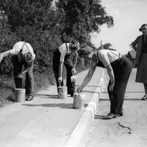 Women Road Painters, 1941 Women painting the kerb white so it can be seen during Women Road Painters, 1941 Women painting the kerb white so it can be seen during