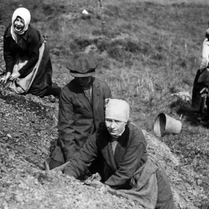 Women with scarves round their heads search a spoil heap near Manchester for fuel during Women with scarves round their heads search a spoil heap near Manchester for fuel during