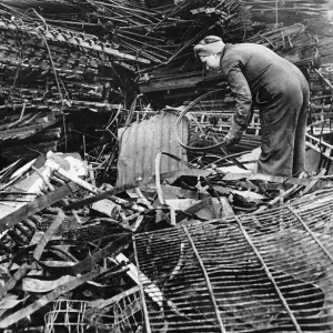 Women scrap locators from the Ministry of Works prepare metal for recycling. WW2