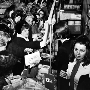 Women shopping for bargains in the sales after christmas. Liverpool, 31st December 1969