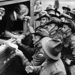 Two women touring London in a mobile information van give directions to Australian