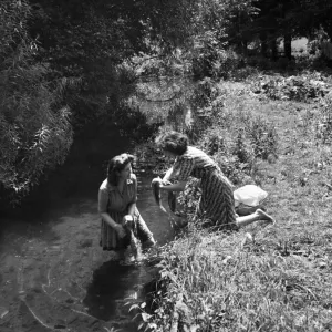 Two Women Washing Clothes in River Chess, July 1945 Print