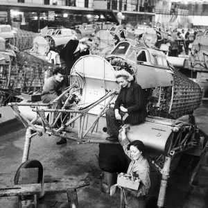 Women work on the production line of Hawker Hurricane aircraft during WW2 Women work on the production line of Hawker Hurricane aircraft during WW2