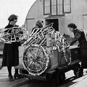 Women workers loading a box at Brocks fireworks factory in Sutton
